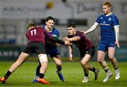 4 January 2025; Paidi Farrell of Leinster is tackled by Ireland players Ciaran Mangan, left, and Gene O'Leary Kareem during the friendly match between Ireland U20 and Leinster Development XV at Energia Park in Dublin. Photo by Ben McShane/Sportsfile