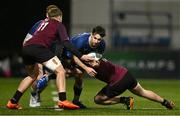 4 January 2025; Paidi Farrell of Leinster is tackled by Ireland players Ciaran Mangan, left and Paddy Taylor during the friendly match between Ireland U20 and Leinster Development XV at Energia Park in Dublin. Photo by Ben McShane/Sportsfile