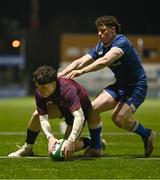 4 January 2025; Will Wootton of Ireland scores a try despite the efforts of Andy Doyle of Leinster during the friendly match between Ireland U20 and Leinster Development XV at Energia Park in Dublin. Photo by Ben McShane/Sportsfile