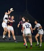 4 January 2025; Mick O'Grady of Kildare gets to the ball ahead of Matthew Thompson of Galway during the Intercounty Football Challenge match between Kildare and Galway at Cedral St Conleth's Park in Newbridge, Kildare. Photo by Piaras Ó Mídheach/Sportsfile