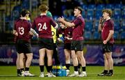 4 January 2025; Dylan Hicks of Ireland, second from right, talks with his team-mates during a break in play in the friendly match between Ireland U20 and Leinster Development XV at Energia Park in Dublin. Photo by Ben McShane/Sportsfile