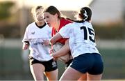 2 January 2025; Elsie Gilmurray of North East is tackled by Emma Wiseman of Midlands during the BearingPoint Sarah Robinson Cup Round 3 match between Midlands and North East at Shay Murtagh Park in Mullingar, Westmeath. Photo by Ben McShane/Sportsfile