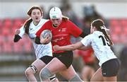 2 January 2025; Erin McFadden of North East evades the tackle of Emma Wiseman of Midlands during the BearingPoint Sarah Robinson Cup Round 3 match between Midlands and North East at Shay Murtagh Park in Mullingar, Westmeath. Photo by Ben McShane/Sportsfile