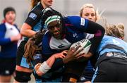 4 January 2025; Alma Atagamen of Wolfhounds is tackled by Gemma Bell, left, and Erinn Foley of Glasgow Warriors during the Celtic Challenge match between Wolfhounds and Glasgow Warriors at Kingspan Stadium in Belfast. Photo by Ramsey Cardy/Sportsfile