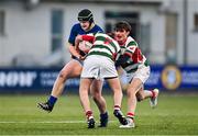 7 January 2025; Henry Regan of Wilson's Hospital is tackled by Zack Kelly, 2, and Rory O'Dowd of St Columba’s College during the Bank of Ireland Leinster Rugby Boys Schools Vinnie Murray Cup 1st Round match between St Columba’s College and Wilson’s Hospital School at Energia Park in Dublin. Photo by Ben McShane/Sportsfile