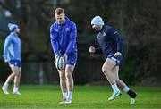 7 January 2025; Ciarán Frawley, centre, and Jordan Larmour, right, during a Leinster Rugby squad training session at UCD in Dublin. Photo by Sam Barnes/Sportsfile