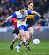 11 January 2025; Darragh Canavan of Errigal Ciarán shoots to score his side's first goal, as Gavin White of Dr Crokes closes in, during the AIB GAA Football All-Ireland Senior Club Championship semi-final match between Dr Crokes and Errigal Ciarán at Cedral St Conleth's Park in Newbridge, Kildare. Photo by Piaras Ó Mídheach/Sportsfile