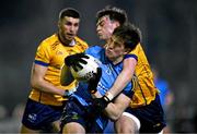 15 January 2025; Daire Cregg of UCD is tackled by Bryan Masterson of DCU Dóchas Éireann during the Electric Ireland Higher Education GAA Sigerson Cup Round 2 match between UCD and DCU at Billings Park in Belfield, Dublin. Photo by Ben McShane/Sportsfile