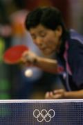 22 August 2004; Kim Hyang Mi of the Peoples Republic of Korea serves to her opponent. Women's Singles Table Tennis Final, Zhang Yining, China v Kim Hyang Mi, Peoples Republic of Korea. Galatsi Indoor Hall. Games of the XXVIII Olympiad, Athens Summer Olympics Games 2004, Athens, Greece. Picture credit; Brendan Moran / SPORTSFILE