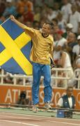 22 August 2004; Stefan Holm of Sweden celebrates winning Gold in the Men's High Jump Final. Olympic Stadium. Games of the XXVIII Olympiad, Athens Summer Olympics Games 2004, Athens, Greece. Picture credit; Brendan Moran / SPORTSFILE