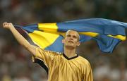 22 August 2004; Stefan Holm of Sweden celebrates winning Gold in the Men's High Jump Final. Olympic Stadium. Games of the XXVIII Olympiad, Athens Summer Olympics Games 2004, Athens, Greece. Picture credit; Brendan Moran / SPORTSFILE