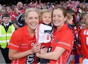 29 September 2013; Two year old Megan Walsh, from Killeagh, Co. Cork, with her godmother and Cork Captain Anne Marie Walsh, right, and Angela Walsh celebrate after the game. TG4 All-Ireland Ladies Football Senior Championship Final, Cork v Kerry, Croke Park, Dublin. Picture credit: Ray McManus / SPORTSFILE