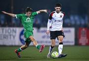 20 January 2025; Harry Groome of Dundalk in action against Keith Ashmore of Usher Celtic during the Leinster Senior Cup match between Dundalk and Usher Celtic at Oriel Park in Dundalk, Louth. Photo by Ben McShane/Sportsfile