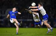 25 January 2025; Ryan O'Neill of Cavan has his kick at a point blocked by Killian Lavelle, left, and Conor McCarthy of Monaghan during the Allianz Football League Division 2 match between Cavan and Monaghan at Kingspan Breffni in Cavan. Photo by Ben McShane/Sportsfile