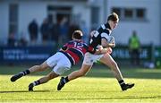 31 January 2025; Dylan Lord of Belvedere College is tackled by Nathan Heatley of Wesley College during the Bank of Ireland Leinster Rugby Boys Schools Senior Cup first round match between Belvedere College and Wesley College at Energia Park in Dublin. Photo by Tyler Miller/Sportsfile