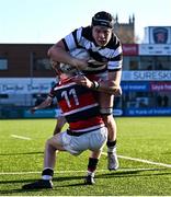 31 January 2025; Paul Dunne of Belvedere College on his way to scoring his side's first try despite the efforts of Jack Duffy of Wesley College during the Bank of Ireland Leinster Rugby Boys Schools Senior Cup first round match between Belvedere College and Wesley College at Energia Park in Dublin. Photo by Tyler Miller/Sportsfile