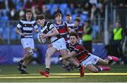 31 January 2025; Jonathon Garrihy of Belvedere College is tackled by Charlie Hempenstall of Wesley College during the Bank of Ireland Leinster Rugby Boys Schools Senior Cup first round match between Belvedere College and Wesley College at Energia Park in Dublin. Photo by Tyler Miller/Sportsfile