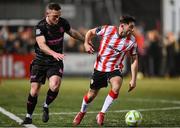 31 January 2025; Adam O'Reilly of Derry City in action against Stephen O'Donnell of Ballymena United during the pre-season friendly match between Derry City and Ballymena United at the Ryan McBride Brandywell Stadium in Derry. Photo by Stephen McCarthy/Sportsfile