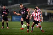 31 January 2025; Patrick McEleney of Ballymena United in action against Adam O'Reilly of Derry City during the pre-season friendly match between Derry City and Ballymena United at the Ryan McBride Brandywell Stadium in Derry. Photo by Stephen McCarthy/Sportsfile