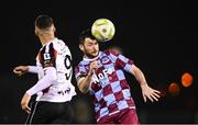 31 January 2025; Ryan Brennan of Drogheda United wins a header against Dean Ebbe of Dundalk during the Jim Malone Cup match between Dundalk and Drogheda United at Oriel Park in Dundalk, Louth. Photo by Piaras Ó Mídheach/Sportsfile