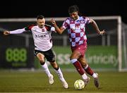 31 January 2025; Aaron Harper Bailey of Drogheda United in action against Dean Ebbe of Dundalk during the Jim Malone Cup match between Dundalk and Drogheda United at Oriel Park in Dundalk, Louth. Photo by Piaras Ó Mídheach/Sportsfile