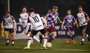 31 January 2025; Joshua Thomas of Drogheda United in action against Leo Gaxha of Dundalk during the Jim Malone Cup match between Dundalk and Drogheda United at Oriel Park in Dundalk, Louth. Photo by Piaras Ó Mídheach/Sportsfile