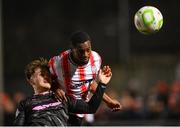 31 January 2025; Sadou Diallo of Derry City and Andy Scott of Ballymena United during the pre-season friendly match between Derry City and Ballymena United at the Ryan McBride Brandywell Stadium in Derry. Photo by Stephen McCarthy/Sportsfile