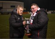 31 January 2025; Dundalk captain Daryl Horgan is presented with the Jim Malone Cup by James Malone, grandson of Jim Malone, after the Jim Malone Cup match between Dundalk and Drogheda United at Oriel Park in Dundalk, Louth. Photo by Piaras Ó Mídheach/Sportsfile