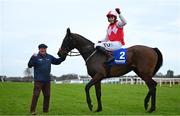 1 February 2025; Keith Donoghue celebrates on Hello Neighbour, along with groom Richie Edwards, after winning the Gannon`s City Recovery & Recycling Services Juvenile Hurdle during day one of the Dublin Racing Festival at Leopardstown Racecourse in Dublin. Photo by Shauna Clinton/Sportsfile