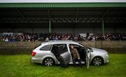 1 February 2025; Spectators Gerry Lawless, right, and Pat Doheny watch on from a car parked in front of the main stand during the Allianz Football League Division 4 match between Tipperary and Longford at the Sportsgrounds in Clonmel, Tipperary. Photo by Tyler Miller/Sportsfile