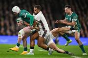 1 February 2025; Mack Hansen of Ireland is tackled by Cadan Murley and Ollie Lawrence of England during the Guinness Six Nations Rugby Championship match between Ireland and England at Aviva Stadium in Dublin. Photo by Brendan Moran/Sportsfile