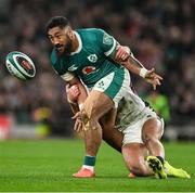 1 February 2025; Bundee Aki of Ireland is tackled by Henry Slade of England during the Guinness Six Nations Rugby Championship match between Ireland and England at Aviva Stadium in Dublin. Photo by Brendan Moran/Sportsfile