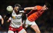 1 February 2025; Mattie Donnelly of Tyrone is tackled by Ben Crealey of Armagh during the Allianz Football League Division 1 match between Armagh and Tyrone at BOX-IT Athletic Grounds in Armagh. Photo by Ben McShane/Sportsfile