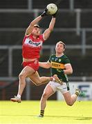 2 February 2025; Conor Doherty of Derry in action against Tadhg Morley of Kerry during the Allianz Football League Division 1 match between Derry and Kerry at Celtic Park in Derry. Photo by Stephen McCarthy/Sportsfile