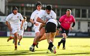 4 February 2025; Cian Phelan of Presentation College, Bray is tackled by Donal Larkin of Newbridge College during the Bank of Ireland Leinster Rugby Boys Schools Junior Cup First Round match between Newbridge College and Presentation College, Bray at Energia Park in Dublin. Photo by Shauna Clinton/Sportsfile