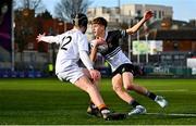 4 February 2025; Ryan Crawford of Newbridge College evades the tackle of Ethan Lyons of Presentation College, Bray during the Bank of Ireland Leinster Rugby Boys Schools Junior Cup First Round match between Newbridge College and Presentation College, Bray at Energia Park in Dublin. Photo by Shauna Clinton/Sportsfile