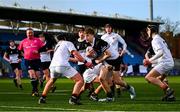 4 February 2025; Ryan Crawford of Newbridge College is tackled by Presentation College, Bray players Rory Hussman Byrne, left, and Conor McDonald during the Bank of Ireland Leinster Rugby Boys Schools Junior Cup First Round match between Newbridge College and Presentation College, Bray at Energia Park in Dublin. Photo by Shauna Clinton/Sportsfile