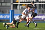 4 February 2025; Amaury Journée McKeown of Presentation College, Bray is tackled by Newbridge College players Ryan Crawford, left, and Marc Daly during the Bank of Ireland Leinster Rugby Boys Schools Junior Cup First Round match between Newbridge College and Presentation College, Bray at Energia Park in Dublin. Photo by Shauna Clinton/Sportsfile