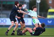 4 February 2025; Paul Batten of Gonzaga College is tackled by Sam Maguire of Wesley College during the Bank of Ireland Leinster Rugby Boys Schools Junior Cup First Round match between Wesley College and Gonzaga College at Energia Park in Dublin. Photo by Shauna Clinton/Sportsfile