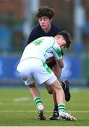 4 February 2025; Marcos Sherrard of Wesley College is tackled by Evan Doyle of Gonzaga College during the Bank of Ireland Leinster Rugby Boys Schools Junior Cup First Round match between Wesley College and Gonzaga College at Energia Park in Dublin. Photo by Shauna Clinton/Sportsfile