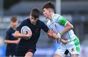 4 February 2025; Matthew Dignam of Wesley College is tackled by Evan Doyle of Gonzaga College during the Bank of Ireland Leinster Rugby Boys Schools Junior Cup First Round match between Wesley College and Gonzaga College at Energia Park in Dublin. Photo by Shauna Clinton/Sportsfile