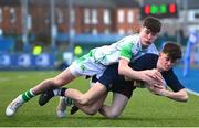 4 February 2025; Ben Elliott of Wesley College is tackled by Evan Doyle of Gonzaga College during the Bank of Ireland Leinster Rugby Boys Schools Junior Cup First Round match between Wesley College and Gonzaga College at Energia Park in Dublin. Photo by Shauna Clinton/Sportsfile