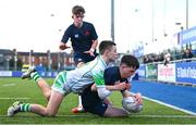 4 February 2025; Rhys Ryan of Wesley College scores his side's second try despite the tackle of Sean Tokar of Gonzaga College during the Bank of Ireland Leinster Rugby Boys Schools Junior Cup First Round match between Wesley College and Gonzaga College at Energia Park in Dublin. Photo by Shauna Clinton/Sportsfile