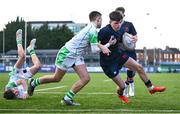 4 February 2025; Rhys Ryan of Wesley College on his way to scoring his side's second try despite the tackle of Sean Tokar of Gonzaga College during the Bank of Ireland Leinster Rugby Boys Schools Junior Cup First Round match between Wesley College and Gonzaga College at Energia Park in Dublin. Photo by Shauna Clinton/Sportsfile