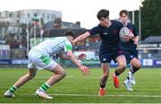 4 February 2025; Rhys Ryan of Wesley College on his way to scoring his side's second try despite the tackle of Evan Doyle of Gonzaga College during the Bank of Ireland Leinster Rugby Boys Schools Junior Cup First Round match between Wesley College and Gonzaga College at Energia Park in Dublin. Photo by Shauna Clinton/Sportsfile