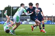 4 February 2025; Rhys Ryan of Wesley College on his way to scoring his side's second try despite the tackle of Sean Tokar of Gonzaga College during the Bank of Ireland Leinster Rugby Boys Schools Junior Cup First Round match between Wesley College and Gonzaga College at Energia Park in Dublin. Photo by Shauna Clinton/Sportsfile