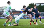 4 February 2025; Rhys Ryan of Wesley College on his way to scoring his side's second try despite the tackle of Evan Doyle of Gonzaga College during the Bank of Ireland Leinster Rugby Boys Schools Junior Cup First Round match between Wesley College and Gonzaga College at Energia Park in Dublin. Photo by Shauna Clinton/Sportsfile