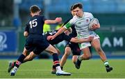 4 February 2025; Paul Batten of Gonzaga College in action against Wesley College players, from left, Louis Rothwell, Max Hamilton and Sean Lee during the Bank of Ireland Leinster Rugby Boys Schools Junior Cup First Round match between Wesley College and Gonzaga College at Energia Park in Dublin. Photo by Shauna Clinton/Sportsfile