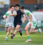 4 February 2025; Mark Garry of Wesley College in action against Gonzaga College players Evan Doyle, left, and Oscar Sugrue-Lynch during the Bank of Ireland Leinster Rugby Boys Schools Junior Cup First Round match between Wesley College and Gonzaga College at Energia Park in Dublin. Photo by Shauna Clinton/Sportsfile