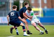 4 February 2025; Cian Dunne of Gonzaga College is tackled by Sam Maguire of Wesley College during the Bank of Ireland Leinster Rugby Boys Schools Junior Cup First Round match between Wesley College and Gonzaga College at Energia Park in Dublin. Photo by Shauna Clinton/Sportsfile